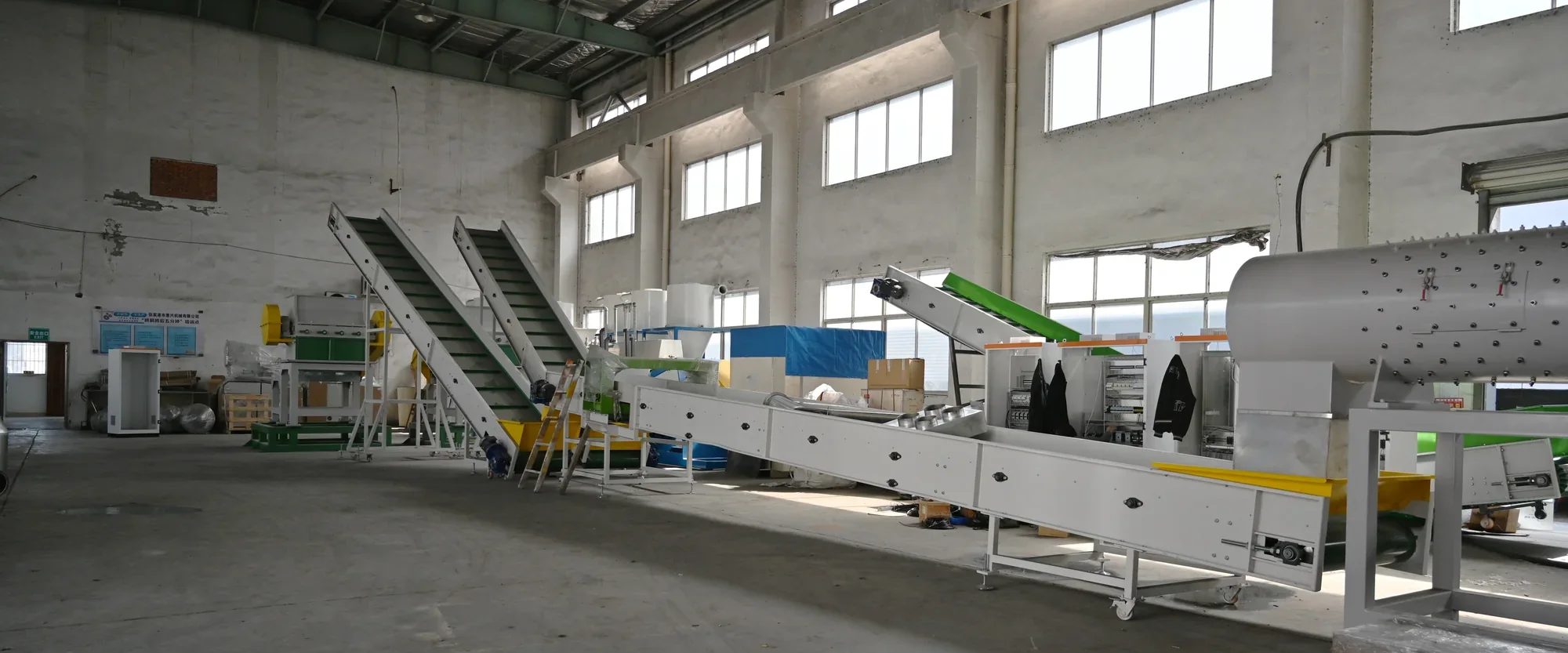 Assembly bay at the BKL-MACHINE plastic recycling machine factory in Zhangjiagang, with washing line stations set out in sequence