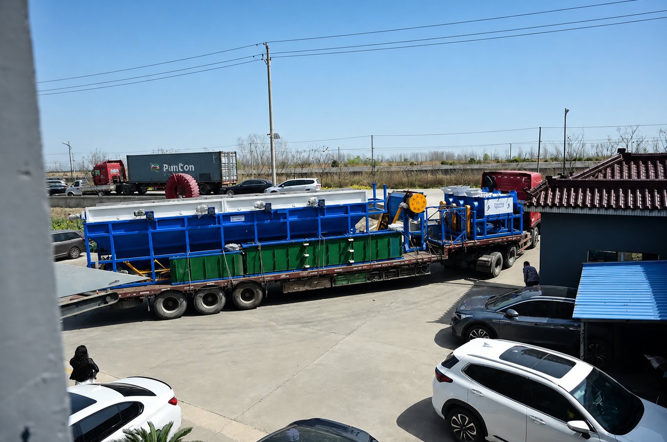 Plastic recycling machine wrapped and secured on a trailer before container loading