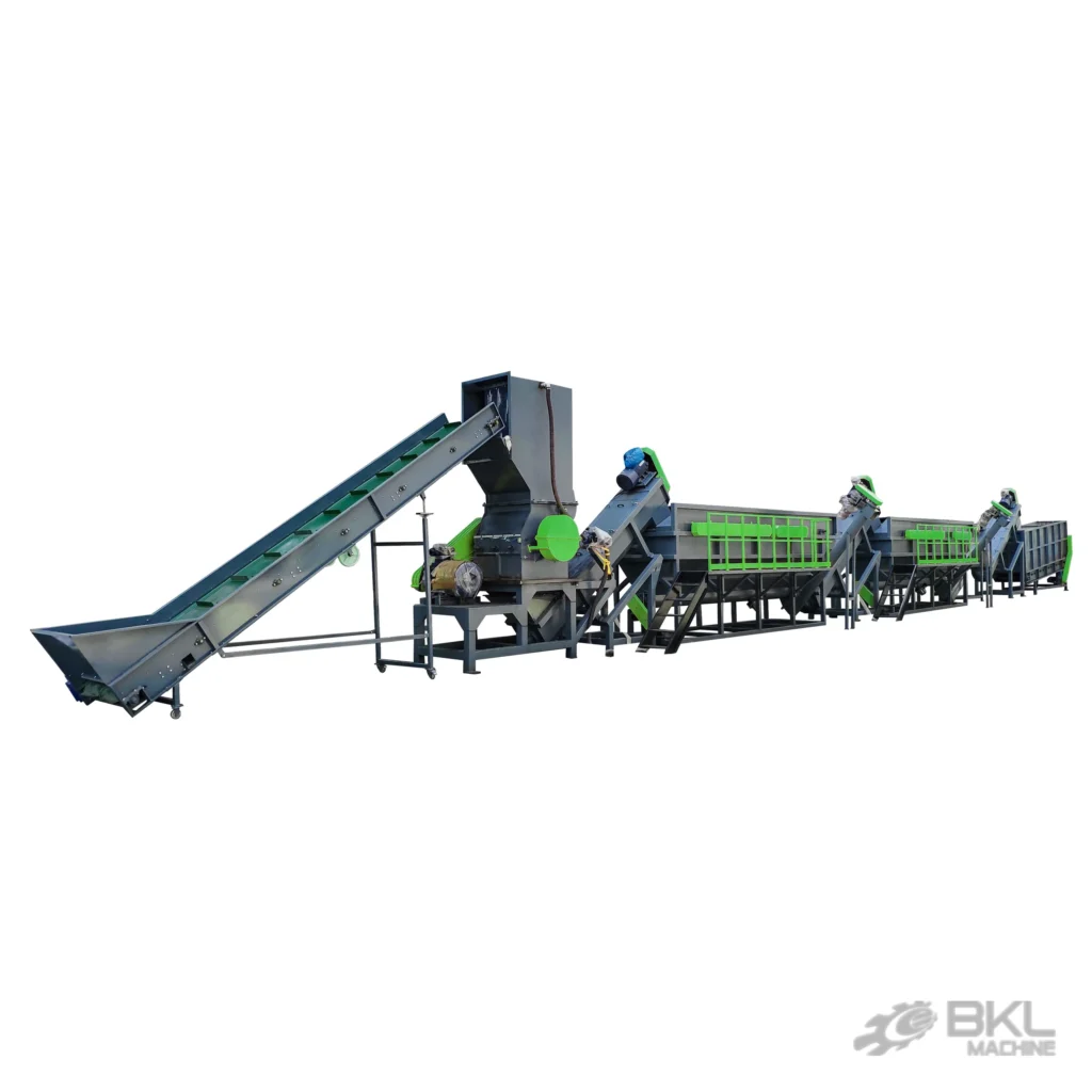 PP raffia bag washing line seen along its length with inclined belt feeder, crusher and green-railed tanks