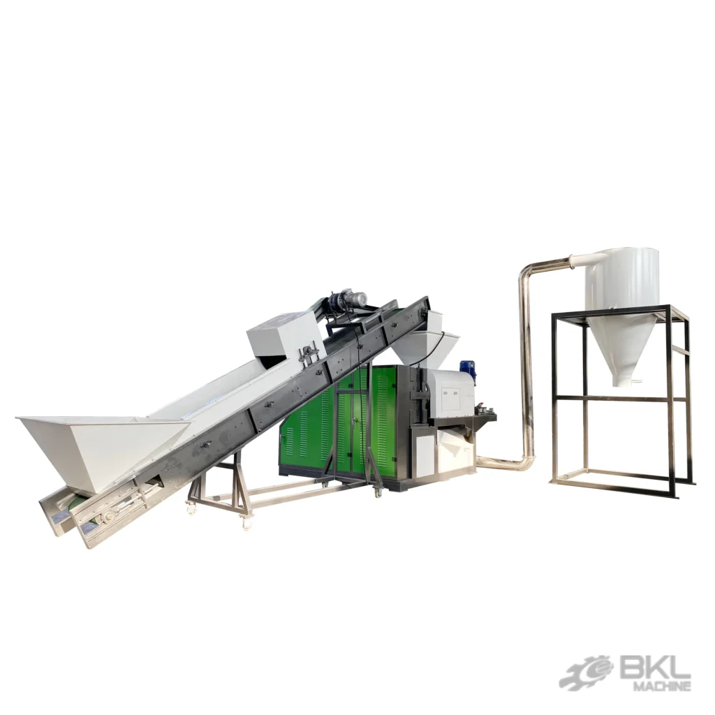 Plastic squeezer dryer fed by an inclined belt conveyor, with green louvred housing and cyclone discharge silo