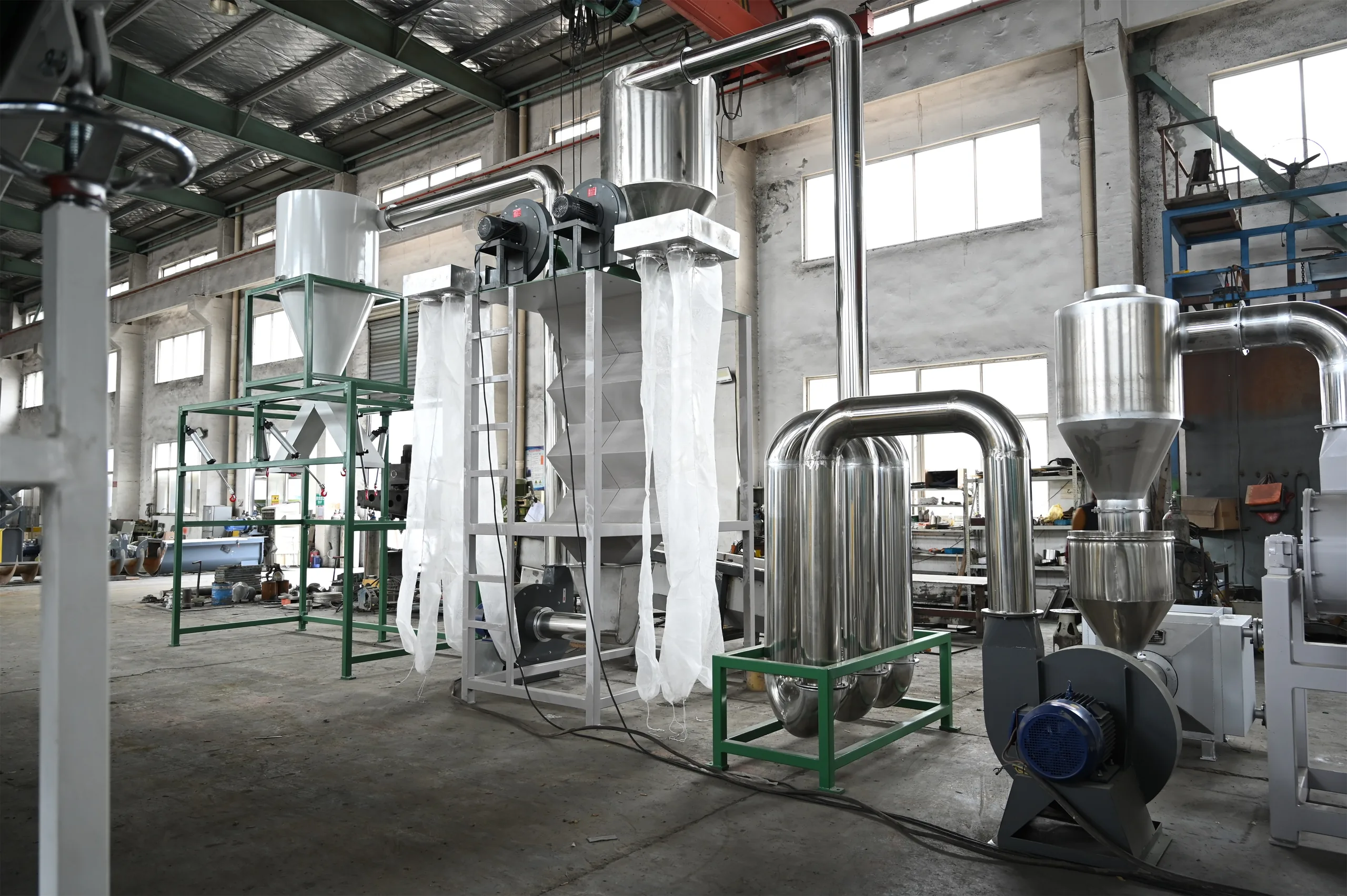 Stainless pipe drying system with cyclone separators and blower feeding flakes into collection bags