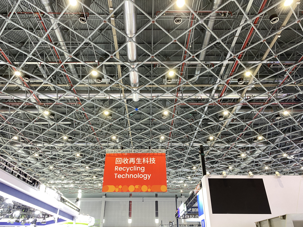 Recycling Technology zone banner above the CHINAPLAS 2024 exhibition hall in Shanghai visited by BKL-MACHINE