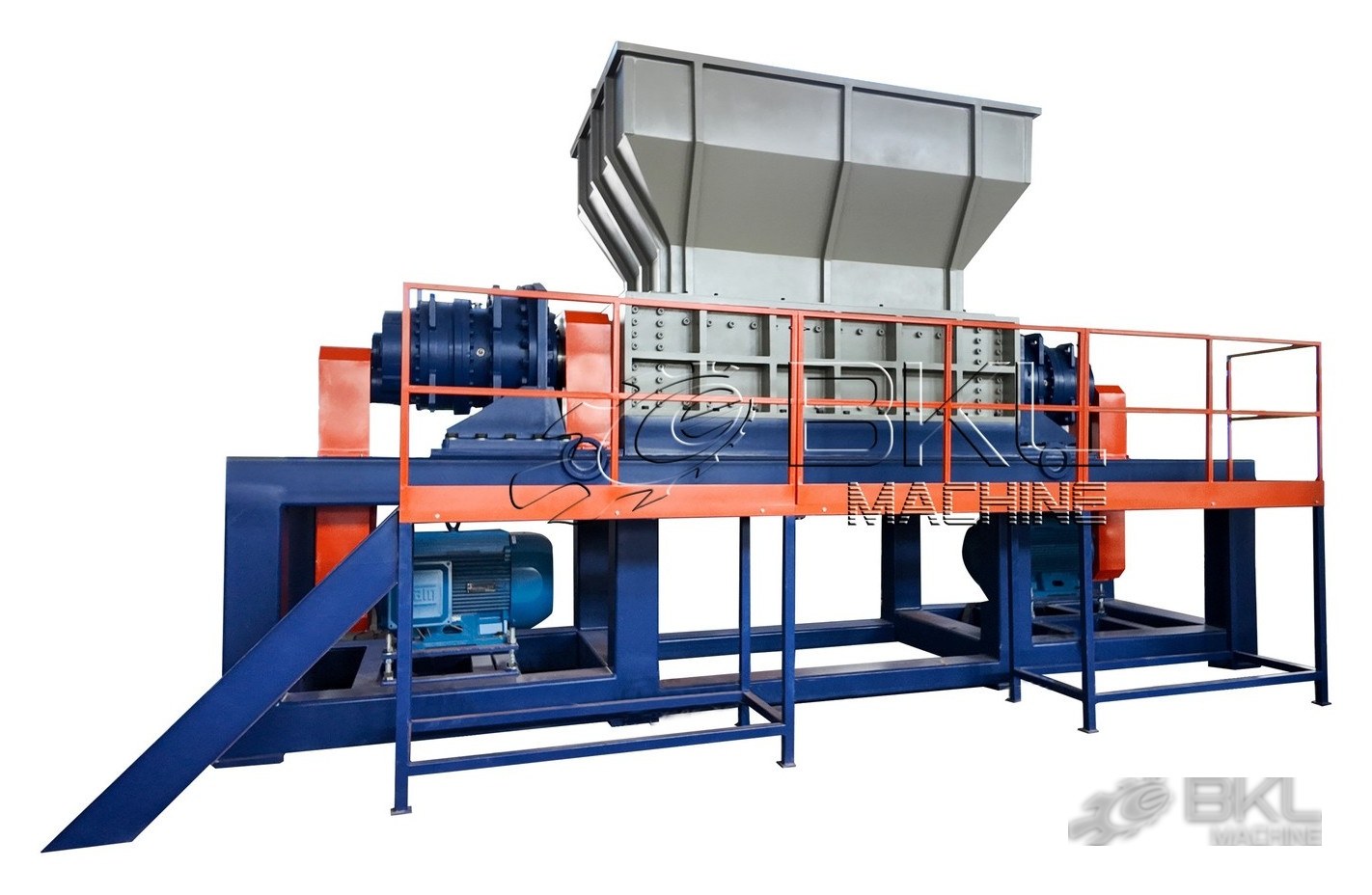 DS twin-shaft shredder with two side gearboxes, orange access platform railing and inclined discharge chute