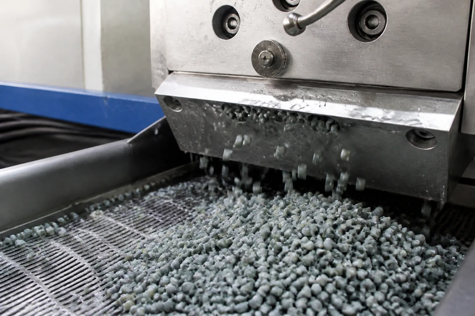 Strand cut recycled pellets leaving the cutter ready for batch sampling at BKL-MACHINE