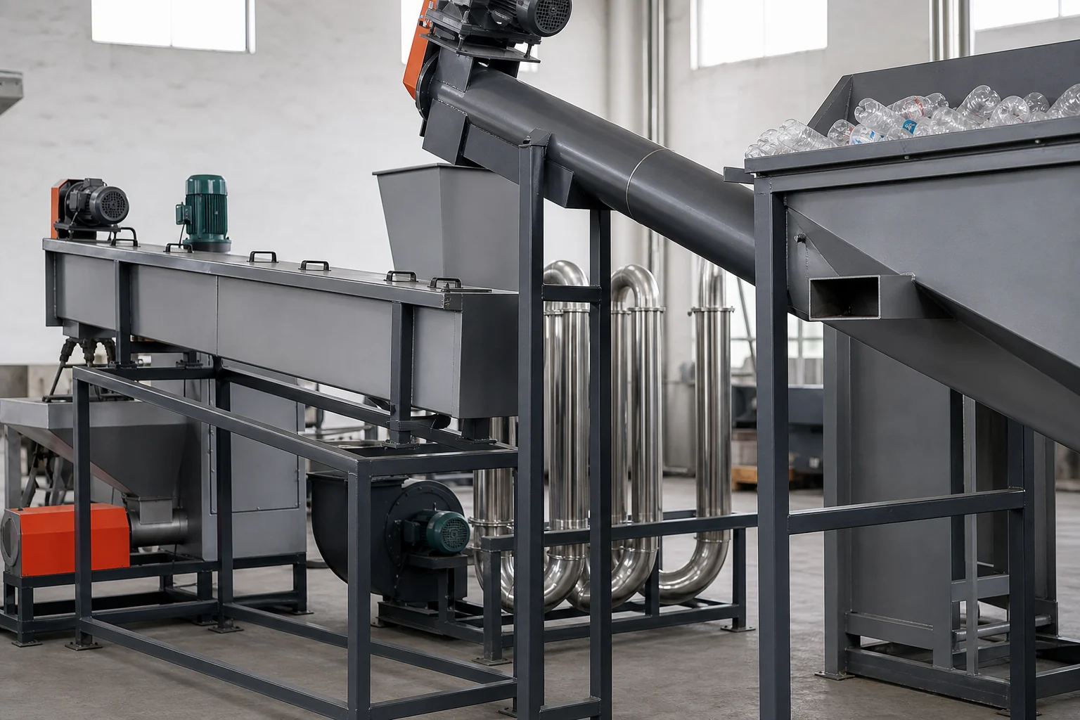Dry label remover stripping labels from whole PET bottles ahead of the crusher at BKL-MACHINE