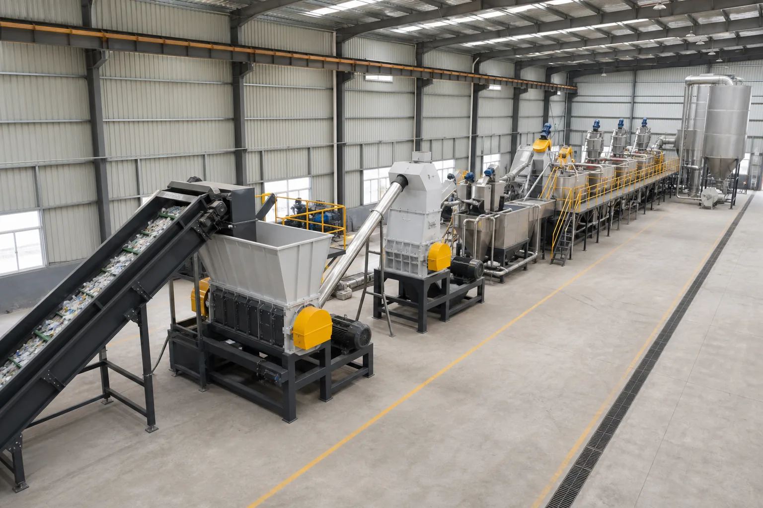 Complete plastic recycling line laid out across a workshop floor from shredder to pelletizer at BKL-MACHINE