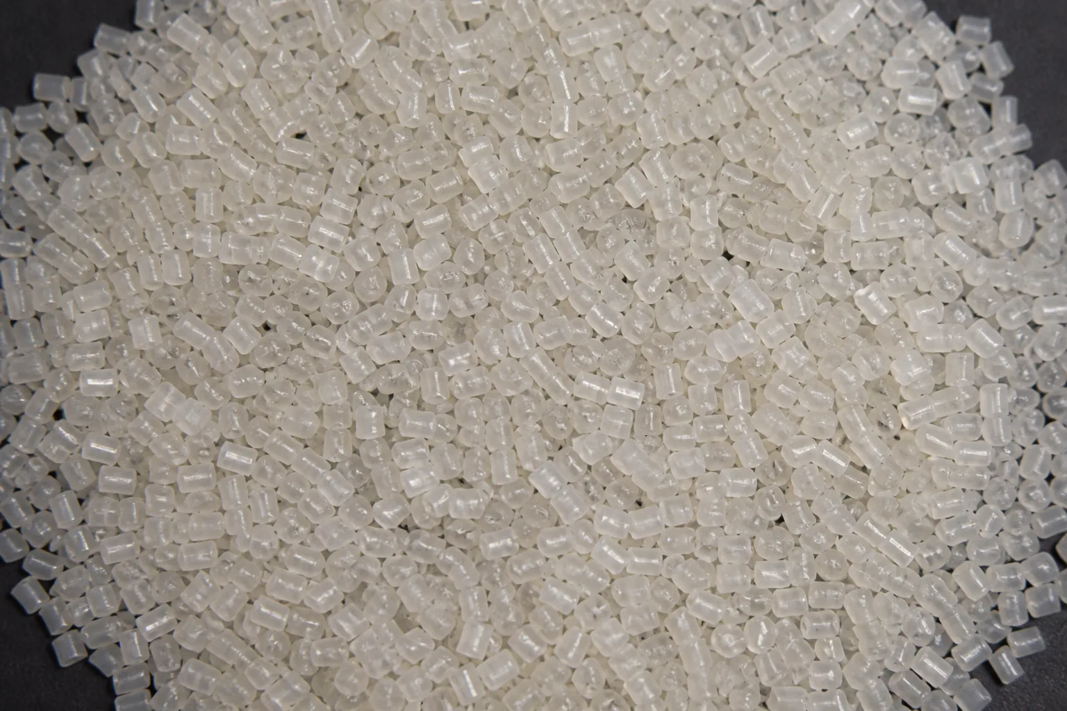 Close view of recycled pellets showing the uniform size and shape a buyer pays a premium for